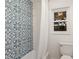 Charming bathroom showcases patterned tile and an oversized soaking tub at 7404 13Th Avenue W Dr, Bradenton, FL 34209