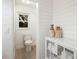Bright bathroom features shiplap walls, a window, and a modern toilet at 7404 13Th Avenue W Dr, Bradenton, FL 34209