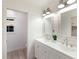 Beautiful bathroom featuring dual sinks, modern fixtures, and bright white cabinets at 7404 13Th Avenue W Dr, Bradenton, FL 34209