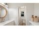 Bright bathroom features a decorative mirror and attractive shiplap walls at 7404 13Th Avenue W Dr, Bradenton, FL 34209