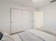 Bright bedroom featuring a large closet and light hardwood flooring at 7404 13Th Avenue W Dr, Bradenton, FL 34209