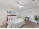 Cozy bedroom featuring a wicker headboard, ample natural light, and stylish decor at 7404 13Th Avenue W Dr, Bradenton, FL 34209