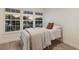 Bedroom featuring natural light, hardwood floors and neutral paint at 7404 13Th Avenue W Dr, Bradenton, FL 34209