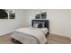 Bedroom featuring neutral paint, hardwood floors and stylish decor at 7404 13Th Avenue W Dr, Bradenton, FL 34209