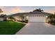 Beautifully landscaped single-story home with a well-maintained lawn and a two-car garage at 7404 13Th Avenue W Dr, Bradenton, FL 34209