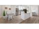 Bright and airy kitchen with modern appliances, white cabinets, and an adjacent dining area at 7404 13Th Avenue W Dr, Bradenton, FL 34209