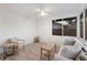 Bright sun room features shiplap walls, large windows, and cozy seating, perfect for relaxing at 7404 13Th Avenue W Dr, Bradenton, FL 34209