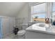 Bright bathroom featuring a marble-tiled backsplash, modern fixtures, and a clean, functional layout at 766 13Th S Ave, St Petersburg, FL 33701