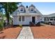 Charming two-story home with a gray exterior, landscaped yard, and a stone walkway at 766 13Th S Ave, St Petersburg, FL 33701