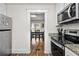 Kitchen view includes a dining area, stainless appliances, and granite countertops at 766 13Th S Ave, St Petersburg, FL 33701