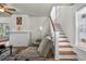 Comfortable living room with a fireplace and staircase access, great for a relaxed atmosphere at 766 13Th S Ave, St Petersburg, FL 33701