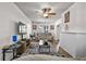 Cozy living room with a ceiling fan, stylish rug, and fireplace, perfect for relaxation at 766 13Th S Ave, St Petersburg, FL 33701