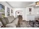 A living room with neutral-colored sofa and modern décor with dark-stained wood-look floors at 766 13Th S Ave, St Petersburg, FL 33701