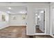 Open living space with wood-look floors and an attached bathroom at 766 13Th S Ave, St Petersburg, FL 33701