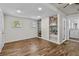 Open floor plan living area with built-in shelving and an attached laundry room at 766 13Th S Ave, St Petersburg, FL 33701