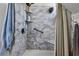 Updated shower with marble-style tiling, built-in shelves, and modern fixtures at 766 13Th S Ave, St Petersburg, FL 33701