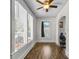Sun-drenched sun room with many windows, light wood floors, and a cozy ambiance at 766 13Th S Ave, St Petersburg, FL 33701