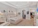 A bedroom featuring a tray ceiling and views of the closet and bathroom at 8020 Clearwater Ct, Sarasota, FL 34241