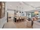 A modern kitchen features white cabinets, stainless steel appliances, and a center island with seating at 8020 Clearwater Ct, Sarasota, FL 34241