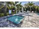Relaxing spa featuring clean water, metal railings, and pool-side lounge chairs at 8020 Clearwater Ct, Sarasota, FL 34241