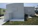 Exterior of house showing white cinderblock screening with patio and air conditioning unit at 845 S Green Cir, Venice, FL 34285