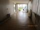 Spacious living area with light-filled glass sliding doors and potential for customization at 845 S Green Cir, Venice, FL 34285