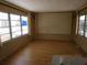 Bright living room featuring large windows and neutral decor, ready for personalized touches at 845 S Green Cir, Venice, FL 34285