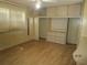 Bedroom with generous built-in storage solutions, including drawers and closet at 845 S Green Cir, Venice, FL 34285