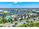 Aerial view of community featuring pool, clubhouse, waterways, and single-Gathering homes at 8962 Baroque Ter, Sarasota, FL 34240