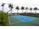 Community basketball court surrounded by a fence, green shrubs and palm trees at 8962 Baroque Ter, Sarasota, FL 34240