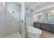 Bathroom boasts a soaking tub, glass shower, and vanity with marble countertop and dark wood cabinets at 8962 Baroque Ter, Sarasota, FL 34240