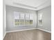 Bright bedroom with a view, plantation shutters and neutral paint at 8962 Baroque Ter, Sarasota, FL 34240