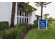 Exterior of the community clubhouse featuring lush landscaping and modern design at 8962 Baroque Ter, Sarasota, FL 34240