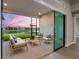 Relaxing screened patio offering comfortable seating and views of the tranquil pond at 8962 Baroque Ter, Sarasota, FL 34240
