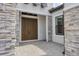 Inviting front entrance with stone accents and a stunning double door at 8962 Baroque Ter, Sarasota, FL 34240