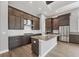 Gourmet kitchen features a large island, stainless steel appliances, and custom cabinets at 8962 Baroque Ter, Sarasota, FL 34240