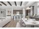 Gourmet kitchen with granite counters, large island, stainless appliances, and an adjacent dining area at 8962 Baroque Ter, Sarasota, FL 34240