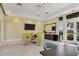 Bright lounge area features modern egg chairs, flat screen tv and beverage bar at 8962 Baroque Ter, Sarasota, FL 34240