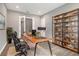 Office with wood desk, shelves, neutral walls and wood-look tile, a perfect workspace at 8962 Baroque Ter, Sarasota, FL 34240