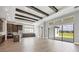 Open floor plan featuring kitchen with island, stainless appliances, and sliding doors leading to the backyard at 8962 Baroque Ter, Sarasota, FL 34240