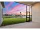 Beautiful backyard view of a well maintained lawn that meets a lake at 8962 Baroque Ter, Sarasota, FL 34240