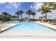 Resort style pool area with several lounge chairs and palm trees in the background at 8962 Baroque Ter, Sarasota, FL 34240