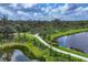Picturesque walking path winding through the community, surrounded by lakes and nature at 8962 Baroque Ter, Sarasota, FL 34240