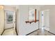 Welcoming entryway with marble tile flooring, a utility window, and convenient access to the kitchen at 9200 Midnight Pass Rd # 30, Sarasota, FL 34242