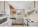 Bright kitchen offering ample cabinet space, modern appliances, and a window with a pleasant view at 9200 Midnight Pass Rd # 30, Sarasota, FL 34242