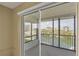 Relaxing lanai offering screened enclosure with views of green space and nearby waterway and beach at 9200 Midnight Pass Rd # 30, Sarasota, FL 34242