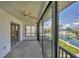 Spacious lanai with floor-to-ceiling windows, providing panoramic views of the waterfront at 9200 Midnight Pass Rd # 30, Sarasota, FL 34242