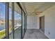 Relaxing screened lanai with ceiling fan, perfect for enjoying the serene waterfront view at 9200 Midnight Pass Rd # 30, Sarasota, FL 34242