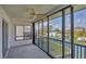 Enclosed lanai with serene views, offering a relaxing space to enjoy waterfront scenery at 9200 Midnight Pass Rd # 30, Sarasota, FL 34242