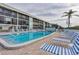 Enjoy the community pool with comfortable lounge chairs, ideal for soaking up the sun at 9200 Midnight Pass Rd # 30, Sarasota, FL 34242